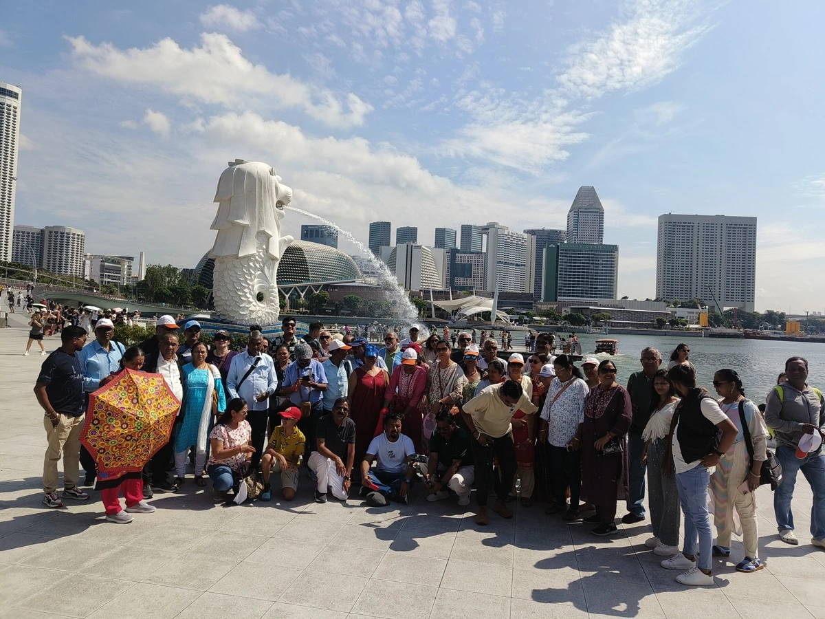 Group enjoying a beach sunset