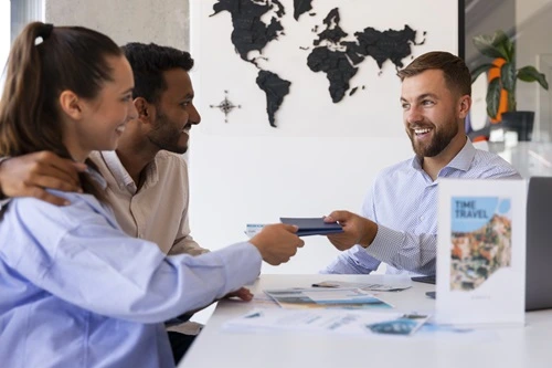 Friendly tour agent helping a customer